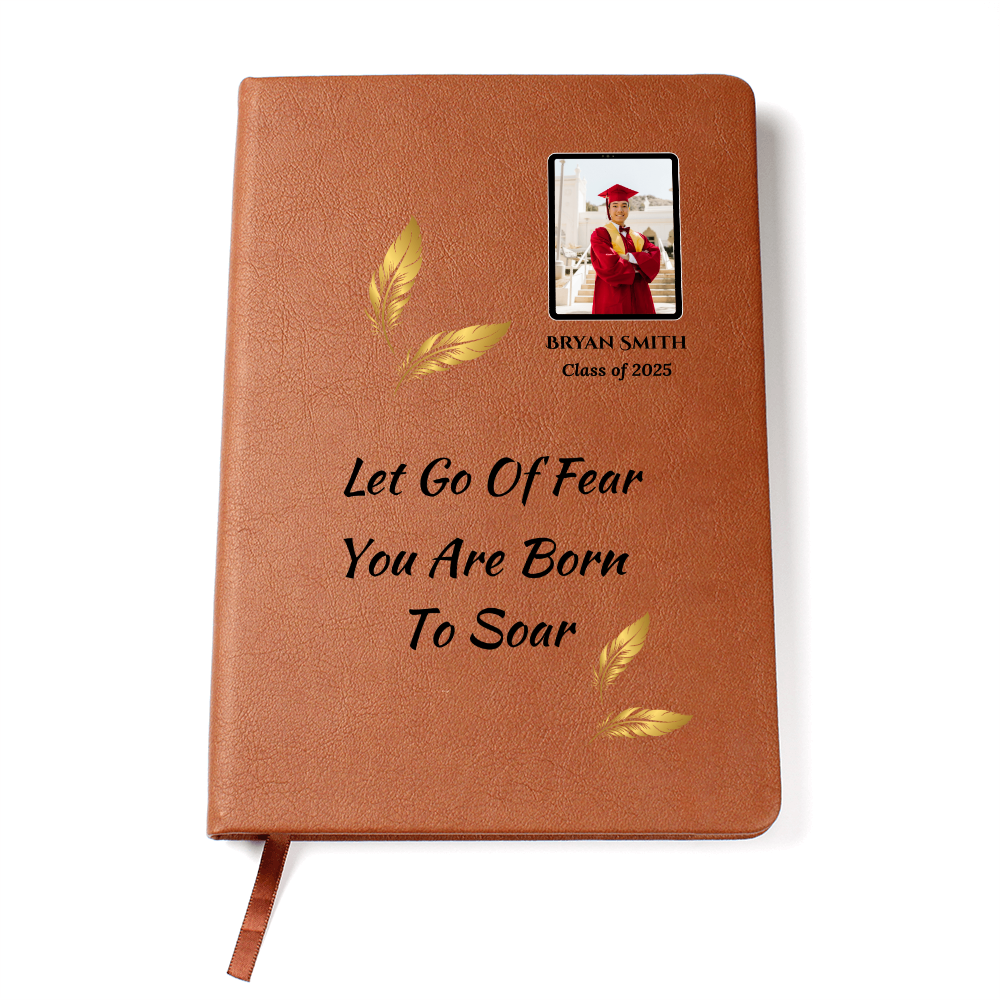 “Personalized graduation journal with inspirational quote ‘Let Go of Fear, You Are Born to Soar’ printed on brown vegan leather cover, featuring graduate’s photo and custom name.”