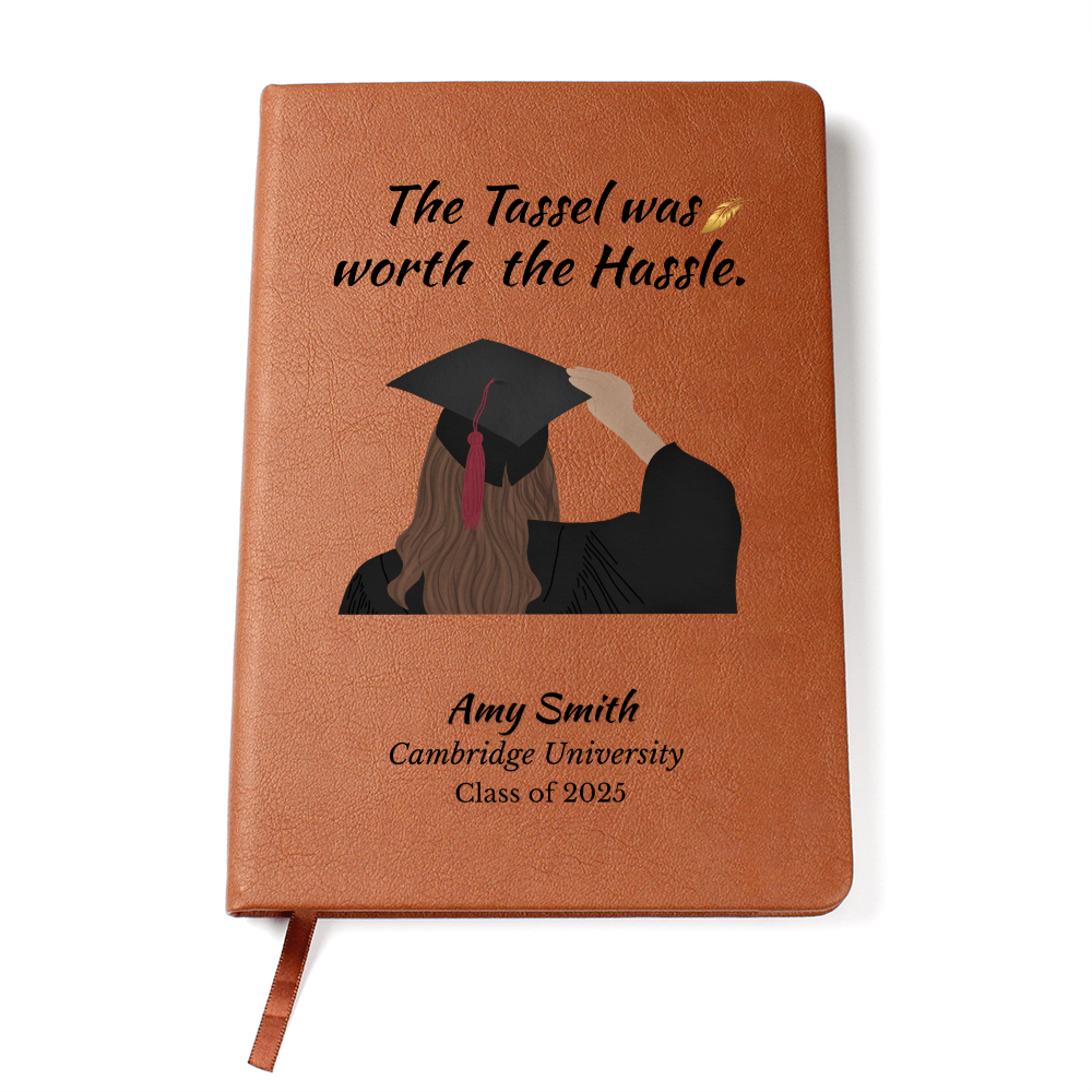 Leather-bound graduation journal with graduate girl illustration and quote “The tassel was worth the hassle” plus custom name and school.