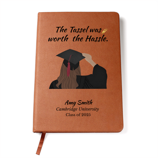 Leather-bound graduation journal with graduate girl illustration and quote “The tassel was worth the hassle” plus custom name and school.