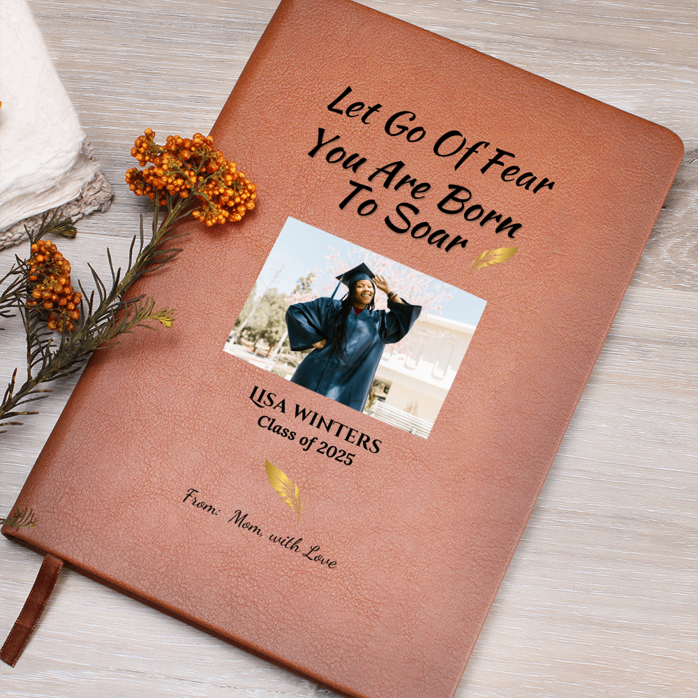 Brown leather journal with photo of Black female graduate in cap and gown. Quote reads “Let Go of Fear. You Are Born to Soar.” Personalized with name, year, and from Mom.
